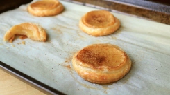 Apple puffs on a baking sheet.