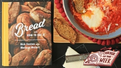 Bread and How to Eat It cookbook next to a pan of eggs in purgatory.