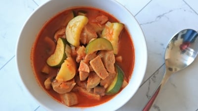 A bowl of giambotta vegetable soup with sausage.
