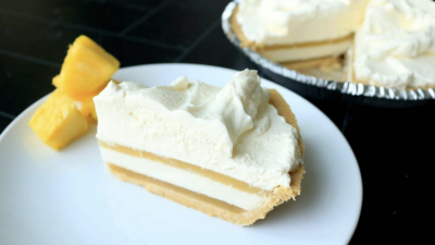 A slice of pineapple coconut pie on a plate.
